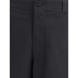 Close-up of Gucci Cotton Pants waistband and button closure, highlighting fine stitching and premium cotton fabric in black.