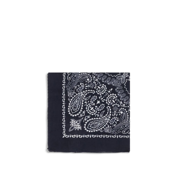 Destin Bandana Scarf in navy blue with white paisley print, folded into a square. Stylish women's accessory for casual or chic outfits.