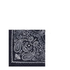 Close-up of Destin Bandana Scarf featuring detailed white paisley design on navy blue fabric. Elegant women's scarf for everyday wear.