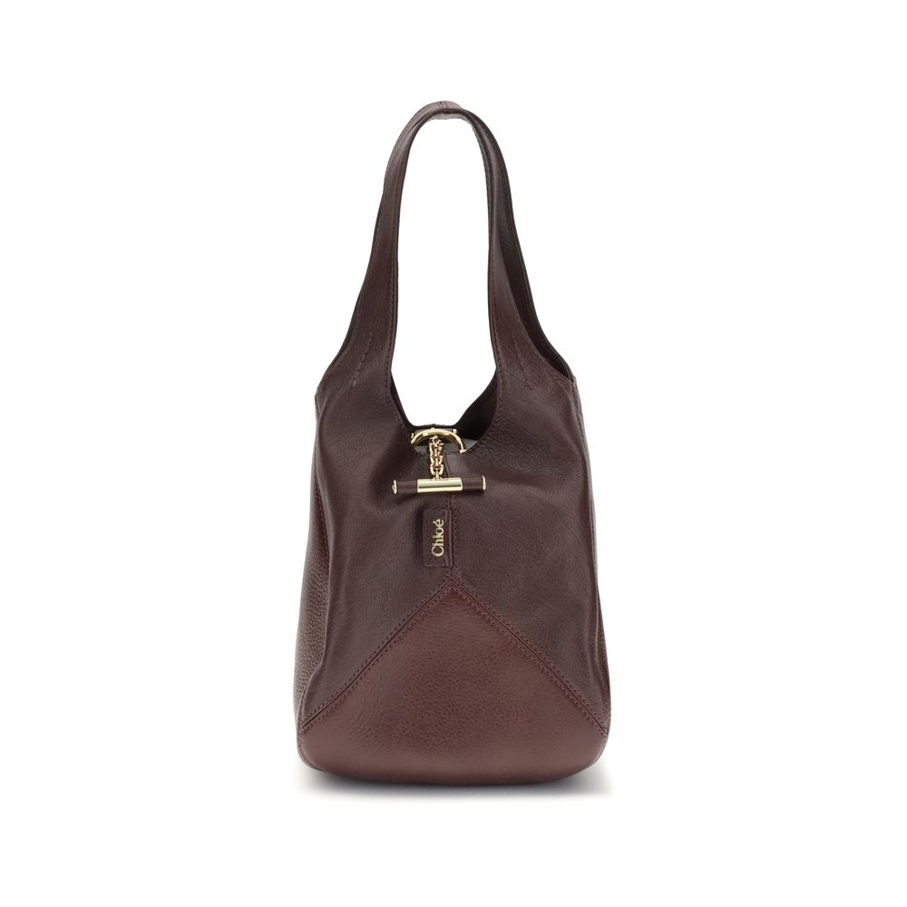 Chloé Small Balloon Shoulder Bag in rich brown leather with a structured silhouette and gold-tone hardware, ideal for women's luxury fashion.