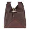Close-up of Chloé Small Balloon Shoulder Bag featuring gold-tone bar closure with engraved logo and fine leather stitching detail.