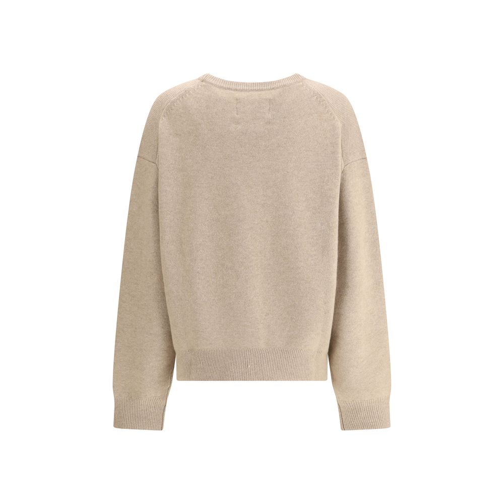 Back view of Extreme Cashmere Mike Sweater n°431 in beige, showcasing its seamless design and soft cashmere texture.