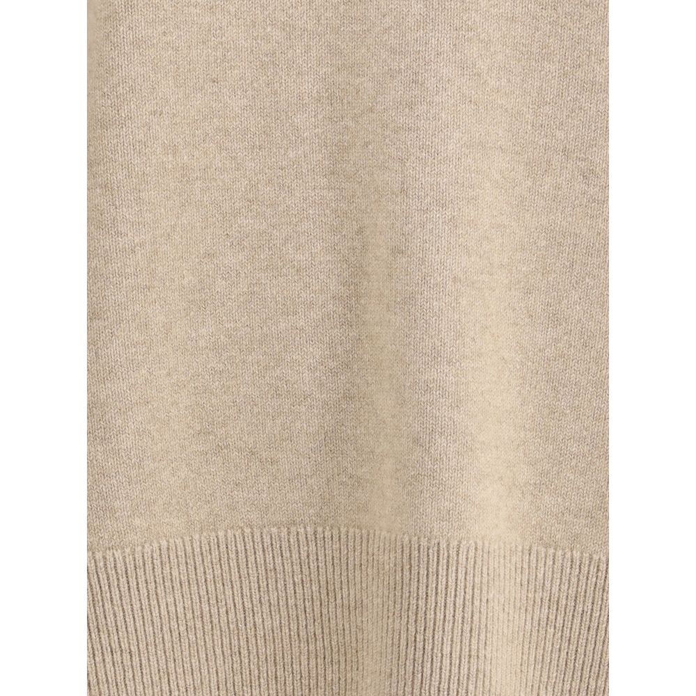 Close-up of Extreme Cashmere Mike Sweater n°431 fabric, highlighting the fine beige cashmere knit and ribbed detailing.