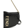 Close-up of Fendi Chain Shoulder Bag highlighting gold FENDI logo and chain strap detail, emphasizing premium craftsmanship and style.